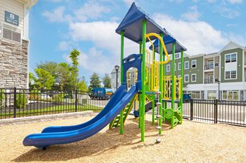 Tot lot with sensory sensitive playground